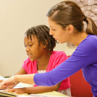SLP student working in clinic with children