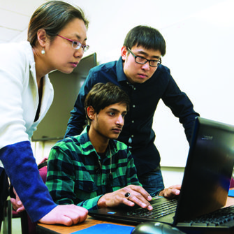 Dr. Yi Yang works with graduate students.