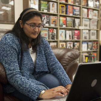 Fontbonne student studying on her laptop