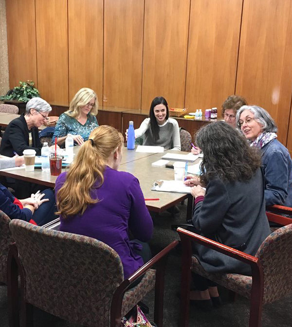 Dr. Lenihan works with students in a roundtable.