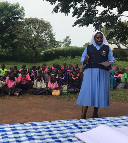 SrHellen teaches a group of students in Gulu, Uganda.