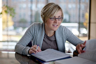 Female student studying in the library.