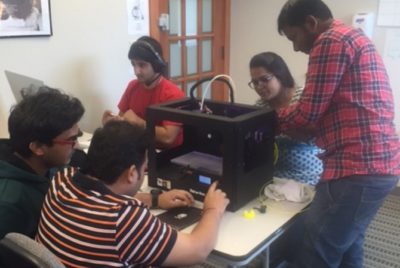 Technology students working in a lab.