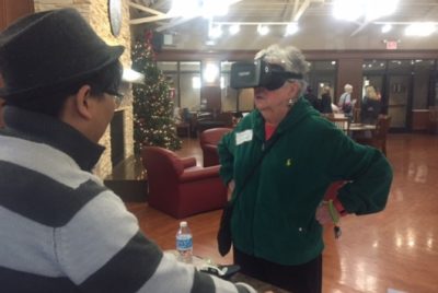 Older lady testing out virtual reality.