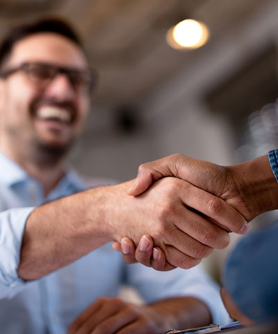 Two business men shaking hands.