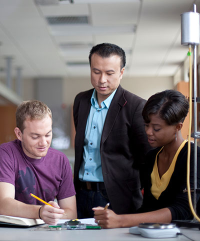 Professor working with students.