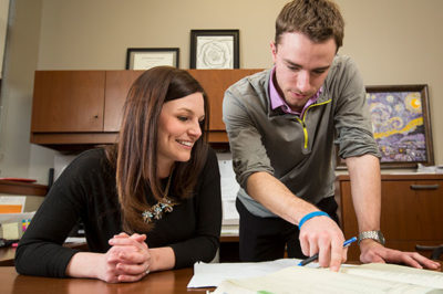 Counselor and student talking.