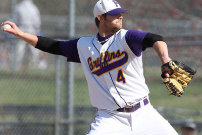 Baseball player pitching.