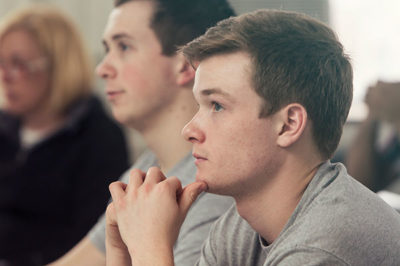Freshman male student in a classroom.