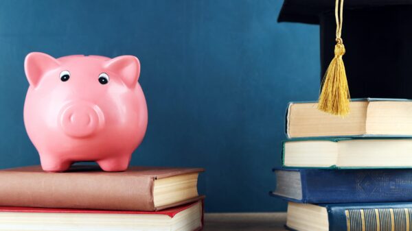 Piggy bank and stack of books