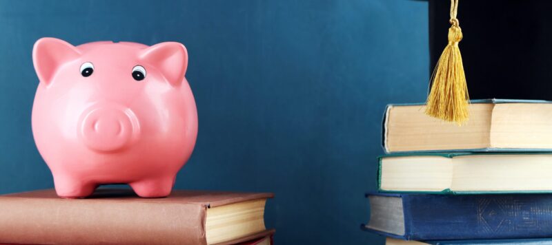 Piggy bank and stack of books